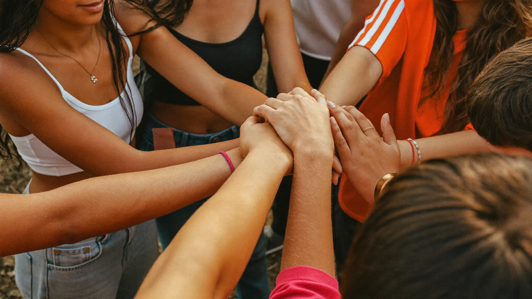 A circle of hands holding on to each other
